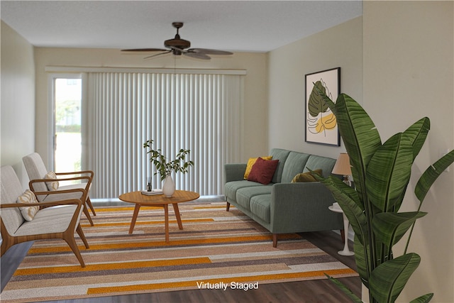 living room featuring hardwood / wood-style flooring and ceiling fan