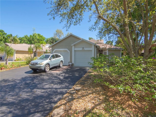 view of front of home featuring an attached garage and driveway