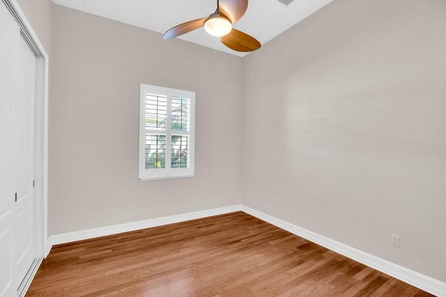 interior space featuring light wood-style flooring, a ceiling fan, and baseboards