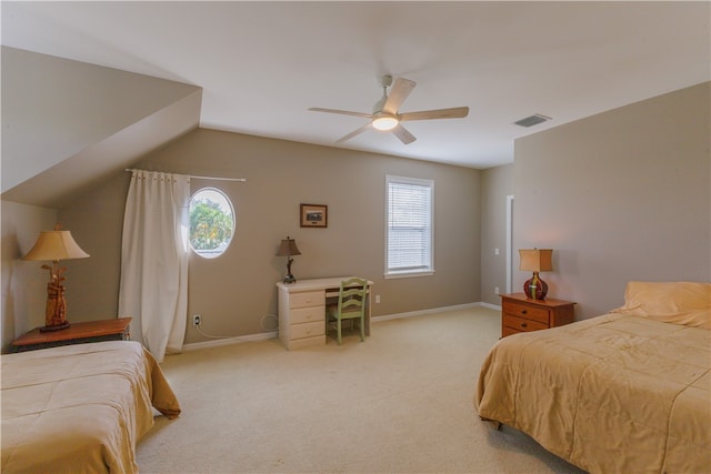 carpeted bedroom with ceiling fan and lofted ceiling