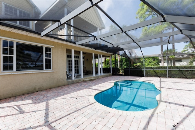 view of pool featuring a patio and a lanai