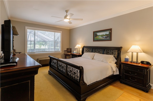 bedroom with ceiling fan, light hardwood / wood-style flooring, and crown molding