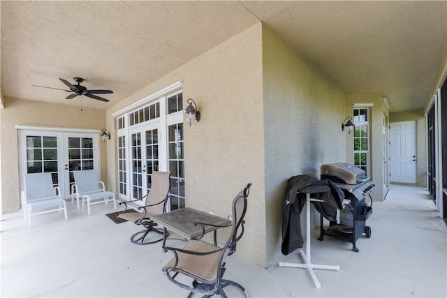 view of patio / terrace with ceiling fan, french doors, and grilling area