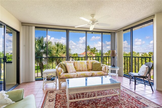 sunroom featuring ceiling fan