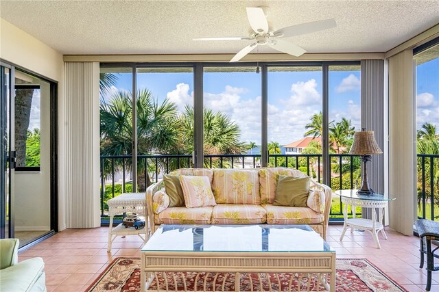 sunroom featuring ceiling fan