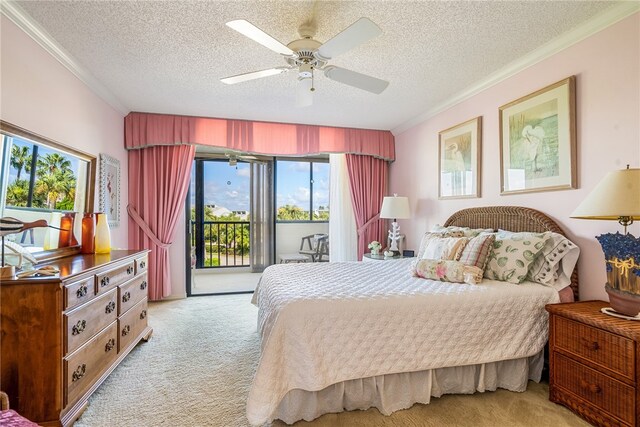 carpeted bedroom with ceiling fan, access to exterior, multiple windows, and a textured ceiling