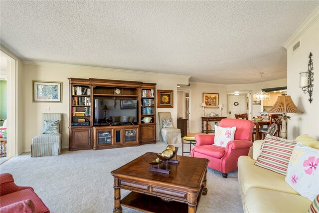 carpeted living room featuring ornamental molding and a textured ceiling