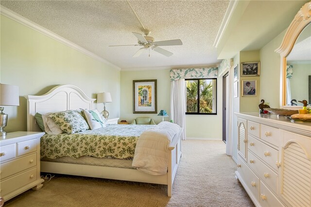 bedroom featuring ceiling fan, a textured ceiling, crown molding, and light colored carpet