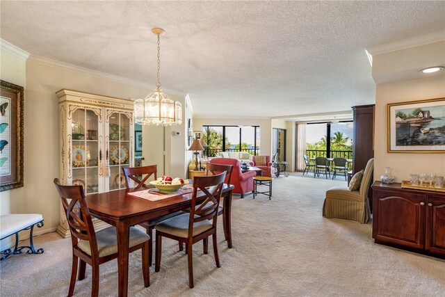 carpeted dining area with a textured ceiling, crown molding, and a notable chandelier