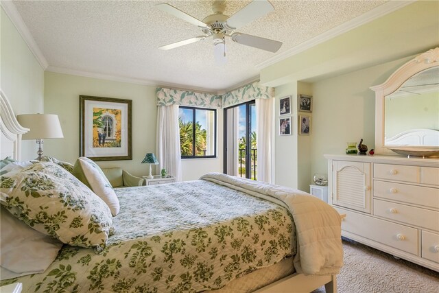 carpeted bedroom with a textured ceiling, ornamental molding, and ceiling fan