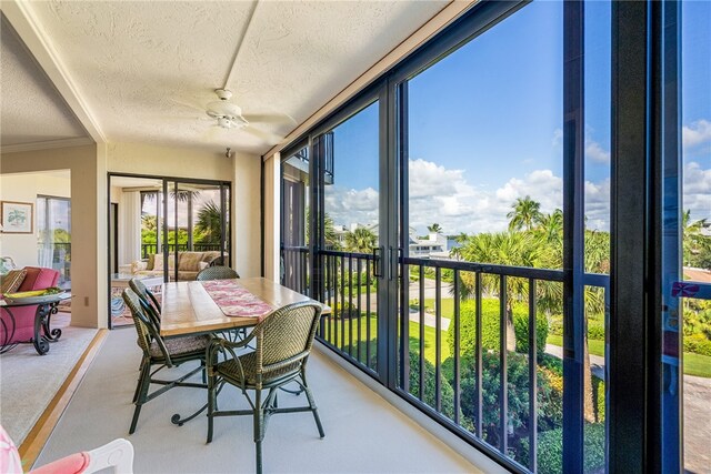 sunroom / solarium with ceiling fan