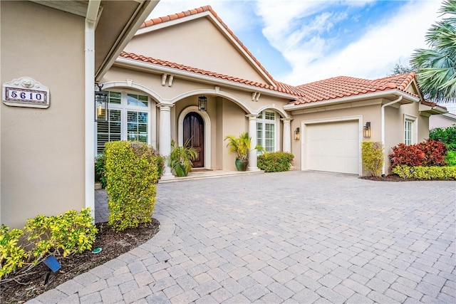 mediterranean / spanish-style home featuring a garage