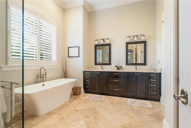 bathroom featuring vanity, a bath, and ornamental molding