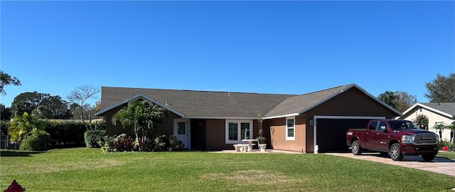 ranch-style house featuring a garage and a front yard