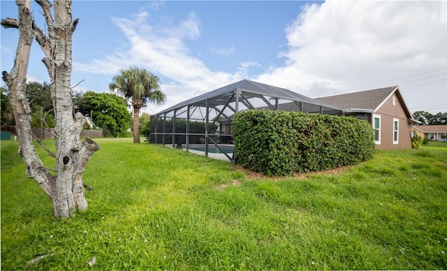 view of yard featuring glass enclosure