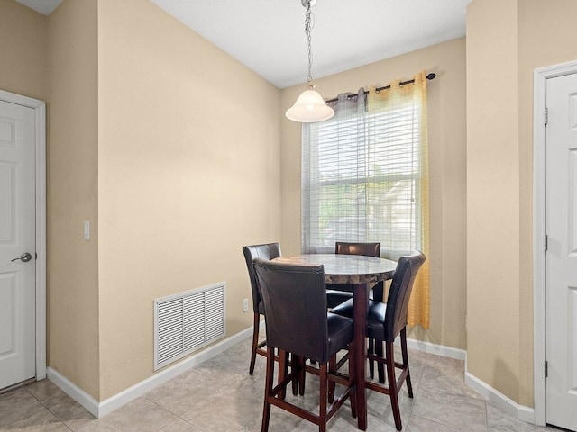 dining area with baseboards and visible vents
