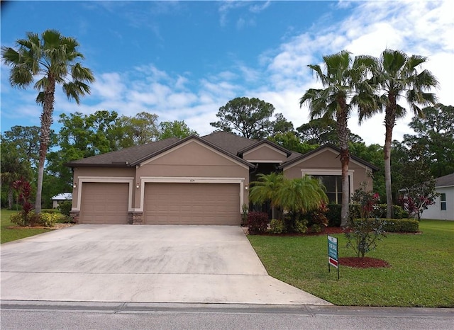 single story home with an attached garage, stucco siding, driveway, and a front yard