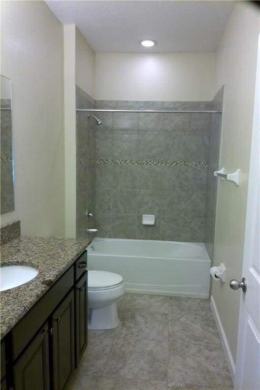 full bath featuring toilet, washtub / shower combination, baseboards, and vanity