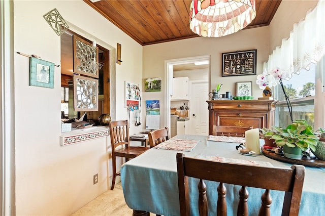 dining area with wooden ceiling and crown molding