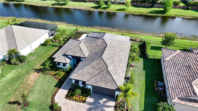 birds eye view of property with a water view