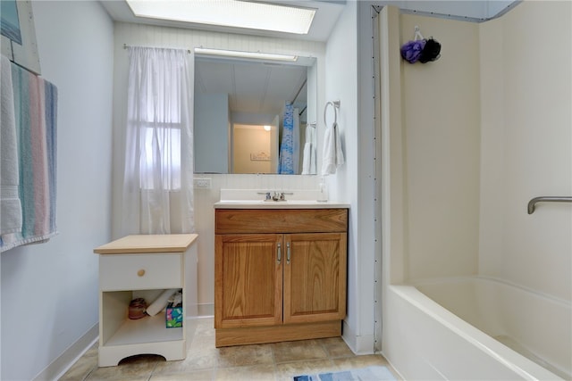 bathroom with vanity and washtub / shower combination