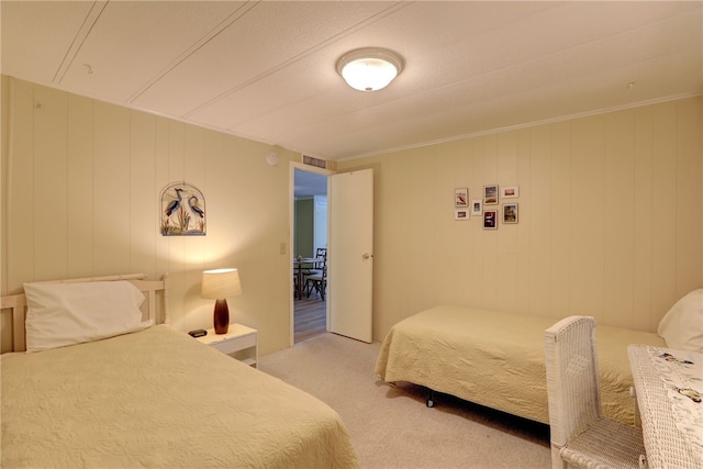 carpeted bedroom featuring ornamental molding