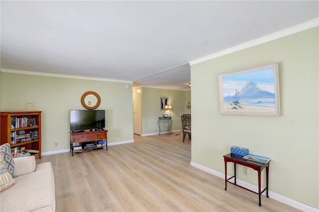 living room featuring light hardwood / wood-style floors and crown molding