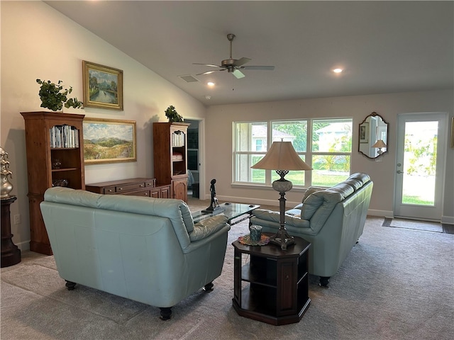 living room with ceiling fan, light colored carpet, and lofted ceiling