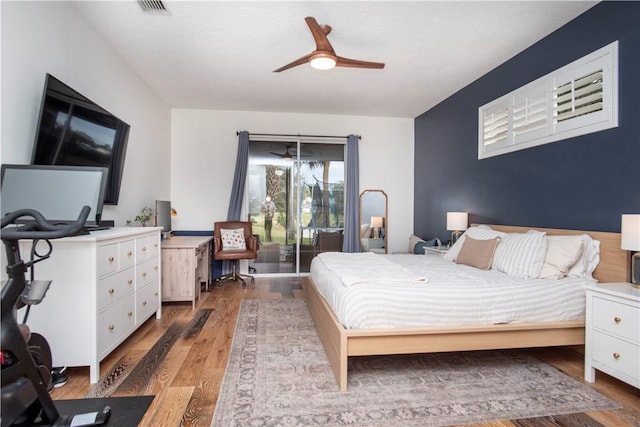 500 45th Ct SW, Vero Beach, FL 32968 - bedroom with a desk, light wood-type flooring, and a ceiling fan