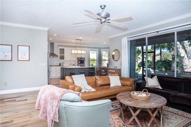 500 45th Ct SW, Vero Beach, FL 32968 - living area with ornamental molding, light wood finished floors, ceiling fan, healthy amount of natural light, and recessed lighting