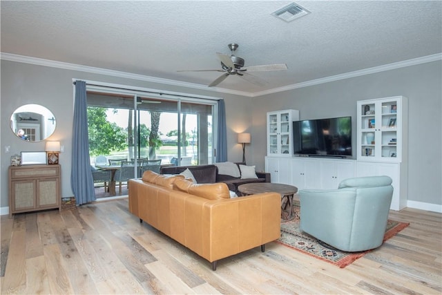500 45th Ct SW, Vero Beach, FL 32968 - living room with light wood finished floors, ceiling fan, a textured ceiling, and ornamental molding