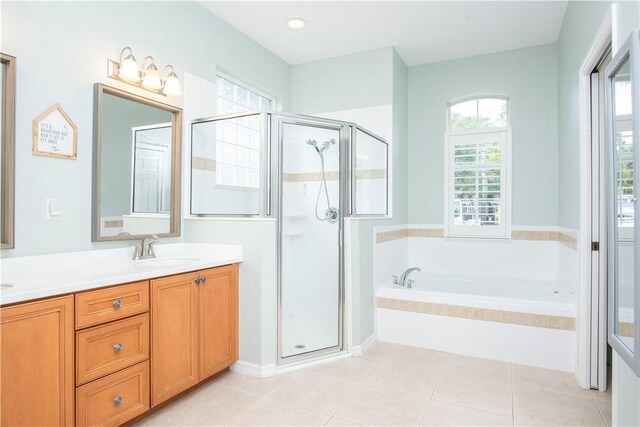 500 45th Ct SW, Vero Beach, FL 32968 - bathroom with a garden tub, a shower stall, double vanity, and tile patterned floors