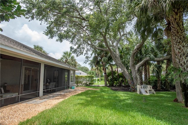 500 45th Ct SW, Vero Beach, FL 32968 - view of grassy yard featuring a sunroom
