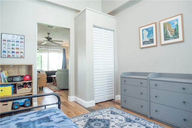 500 45th Ct SW, Vero Beach, FL 32968 - bedroom with wood finished floors, a closet, and crown molding