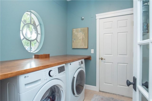 500 45th Ct SW, Vero Beach, FL 32968 - washroom featuring washing machine and dryer and light tile patterned floors