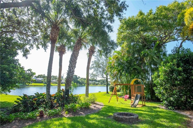 500 45th Ct SW, Vero Beach, FL 32968 - view of grassy yard featuring a playground, a water view, and a fire pit