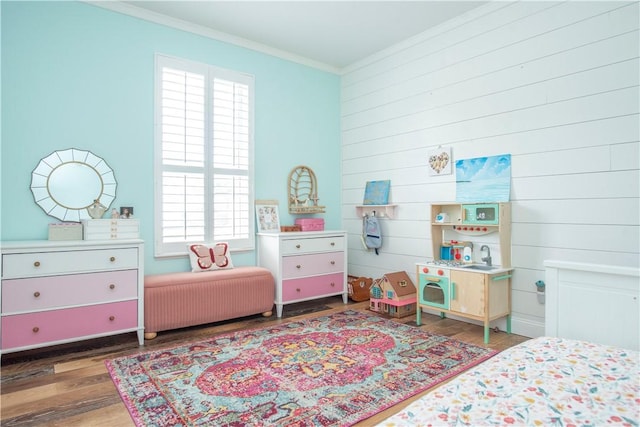 500 45th Ct SW, Vero Beach, FL 32968 - bedroom with crown molding, wood finished floors, and wooden walls