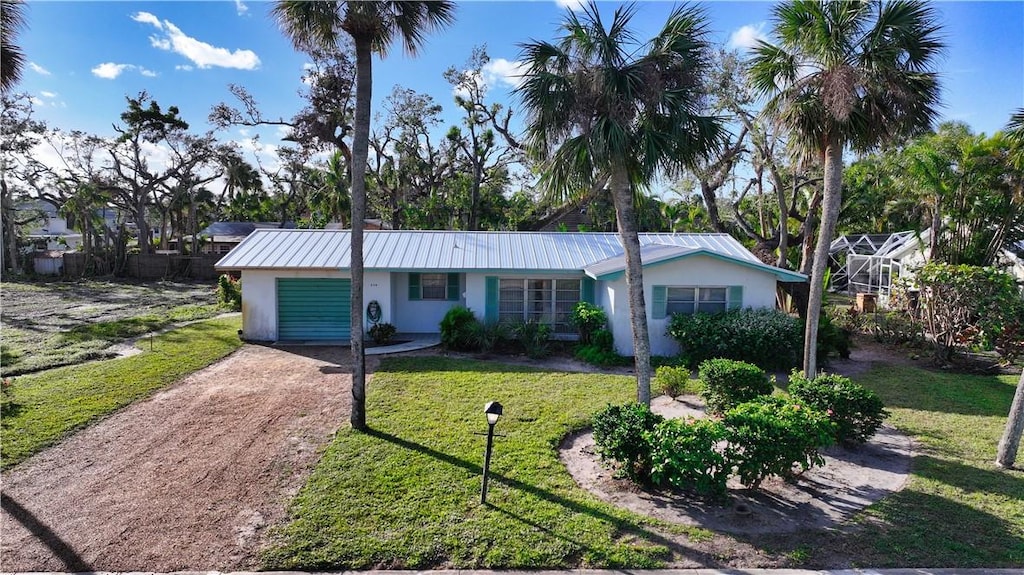 ranch-style home with a front lawn