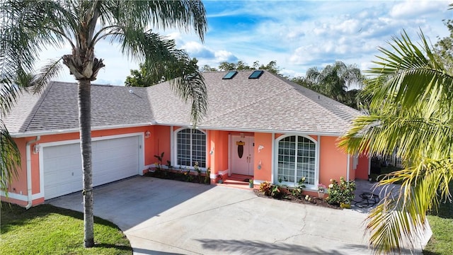 view of front of property with a garage