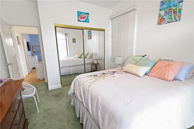 carpeted bedroom with a closet