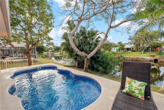 view of swimming pool with a water view