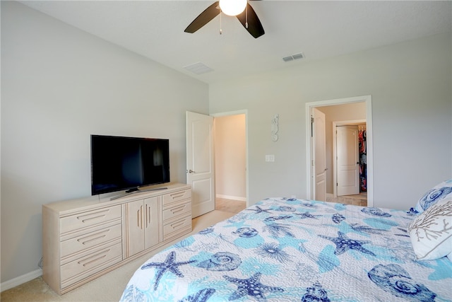 bedroom with light colored carpet and ceiling fan