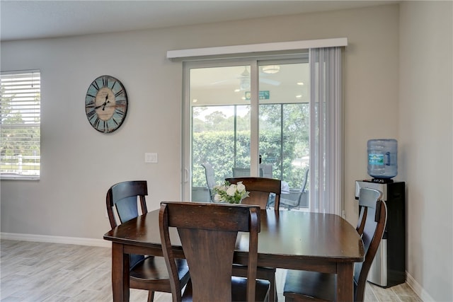 dining room with a wealth of natural light and light hardwood / wood-style floors