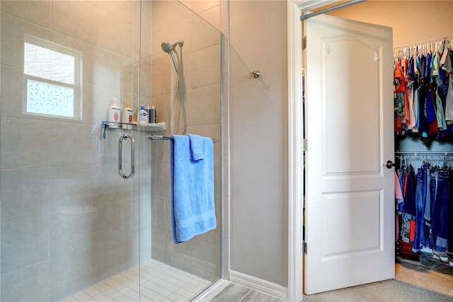 bathroom with a shower with shower door