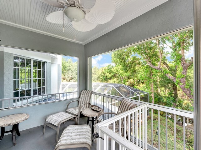 sunroom / solarium with ceiling fan