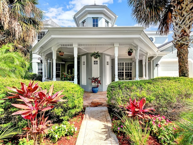 view of front of property with a garage and a porch