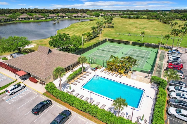 birds eye view of property with a water view