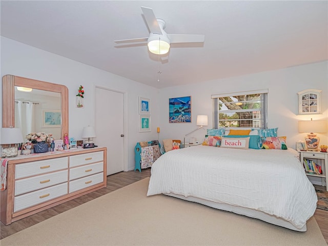 bedroom featuring light hardwood / wood-style flooring and ceiling fan