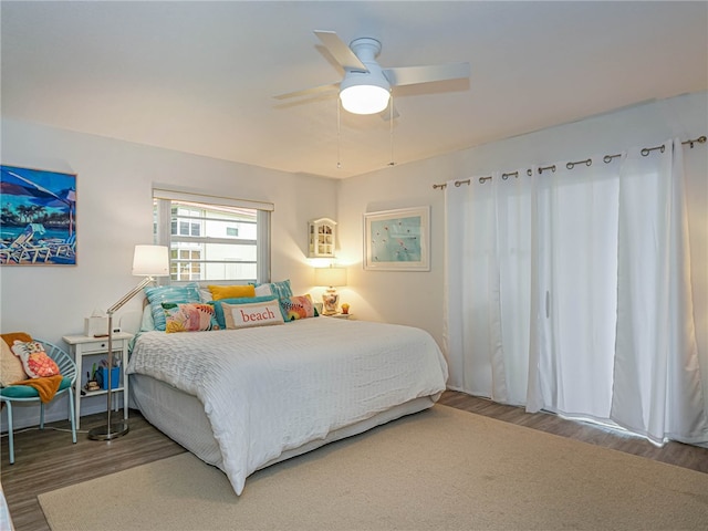 bedroom featuring hardwood / wood-style floors and ceiling fan