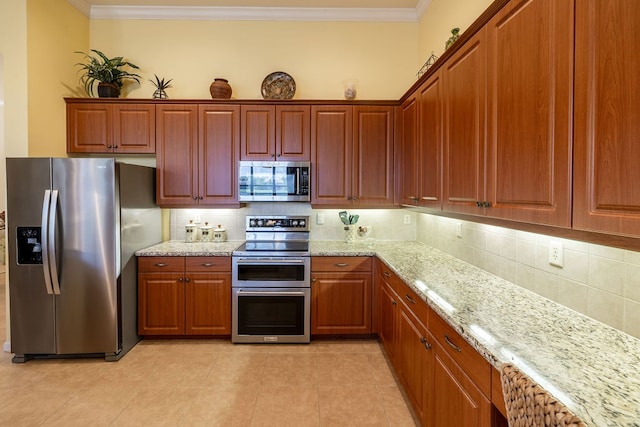 kitchen featuring backsplash, crown molding, light stone counters, and appliances with stainless steel finishes